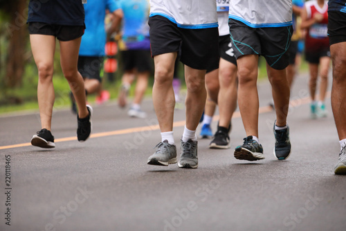 Group of people running race marathon