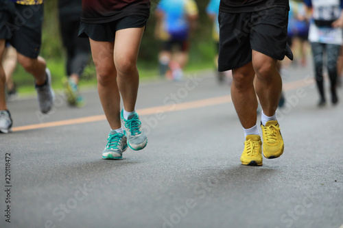 Group of people running race marathon