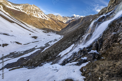 The mountain does not stop the water that start to melt from the snow and flows along it slopes making amazing waterfalls inside the central Andes Valleys at Santiago de Chile