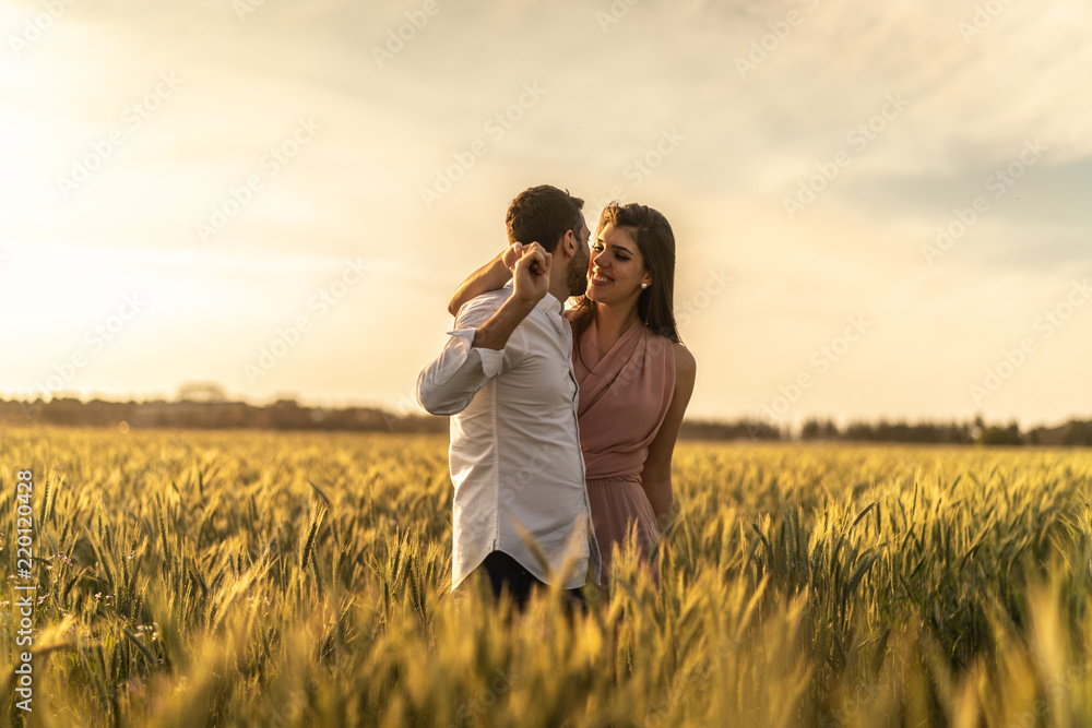 Romantic Couple on a Love Moment at gold wheat field - Holambra, Sao Paulo, Brazil Romantic Couple on a Love Moment at gold wheat field - Holambra, Sao Paulo, Brazil