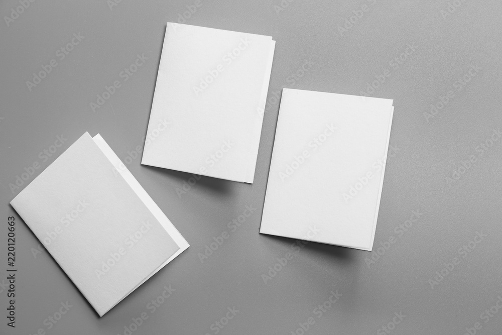 Blank portrait mock-up paper. brochure magazine isolated on gray, changeable background / white paper isolated on gray Blank portrait mock-up paper. brochure magazine isolated on gray, changeable background / white paper isolated on gray