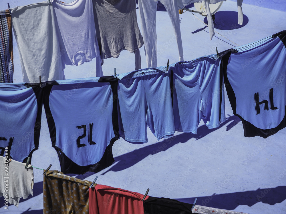 Sports uniforms hanging to dry