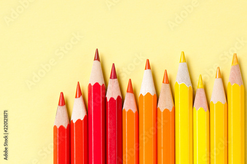 Color pencils isolated on yellow background.    