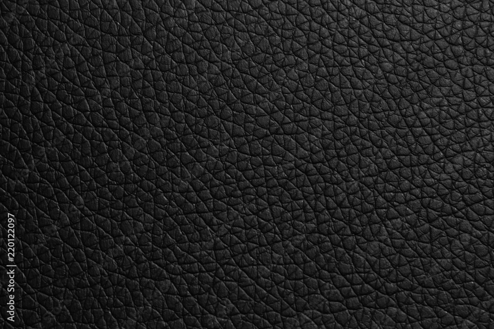 black leather texture or background with spotlight, dark tone. black leather texture or background with spotlight, dark tone.
