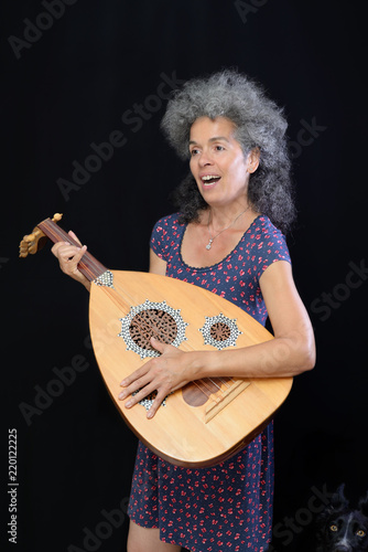 Woman oud instrument Dog companion photo