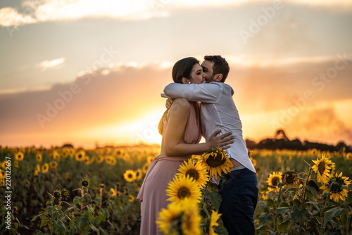 Romantic Couple on a Love Moment in a Sunflower field at Holambra, Sao Paulo, Brazil