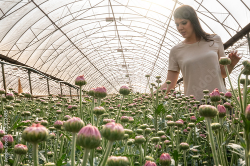 Woman Visiting Greenhouse photo