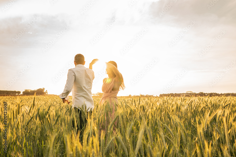 Foto Stock Romantic Couple Dancing on Love Moment at gold wheat field |  Adobe Stock