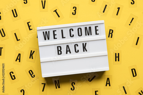Welcome back lightbox message on a bright yellow background
