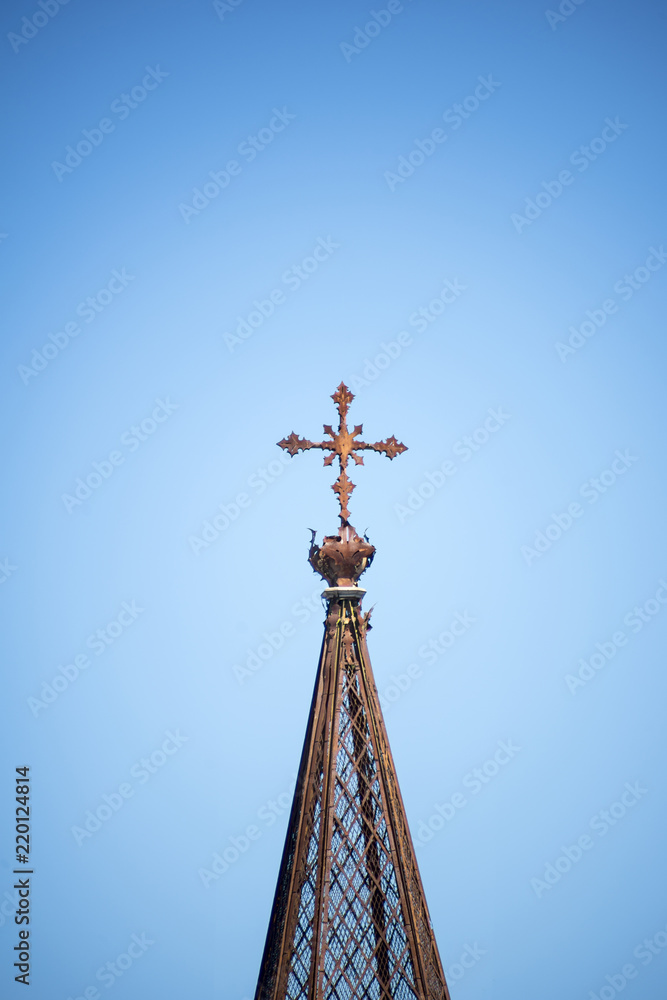 Cross on the top of an old monastery. Spain