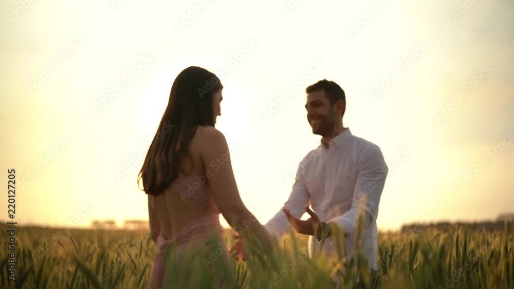 Romantic Couple Dancing at gold wheat flied Romantic Couple Dancing at gold wheat flied