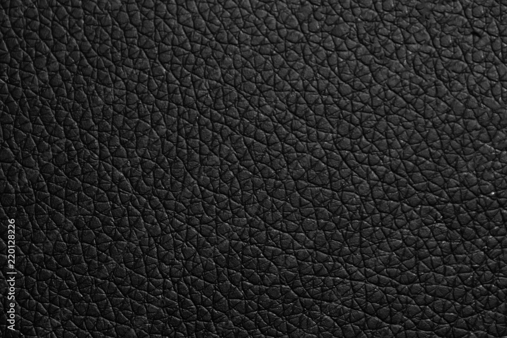black leather texture or background with spotlight, dark tone. black leather texture or background with spotlight, dark tone.