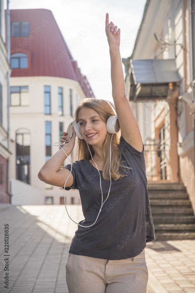girl with headphones listening to music