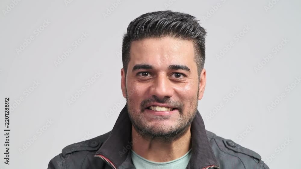 Bearded hipster portrait. Young indian man in autumn clothing exciting win pose in front of camera. Hipster lifestyle concept. Bearded hipster portrait. Young indian man in autumn clothing exciting win pose in front of camera. Hipster lifestyle concept.