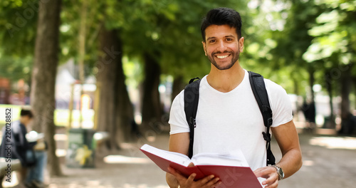 Smiling student outdoor in a college courtyard