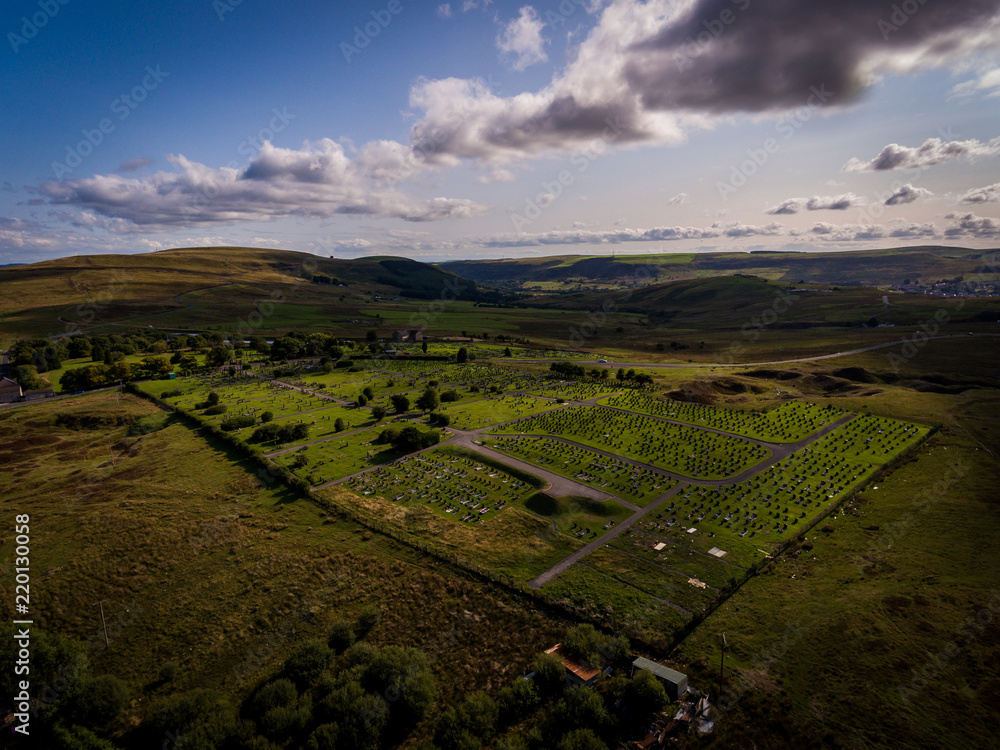 Aerial view of a graveyard on a mountain in South Wales, Tredegar, Cefn Golau