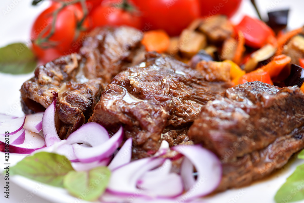 Dish for the restaurant. Fried meat on a plate. Beef with vegetables. Dish for the restaurant. Fried meat on a plate. Beef with vegetables.