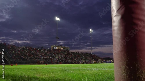 Full high school stadium at dusk dolly photo