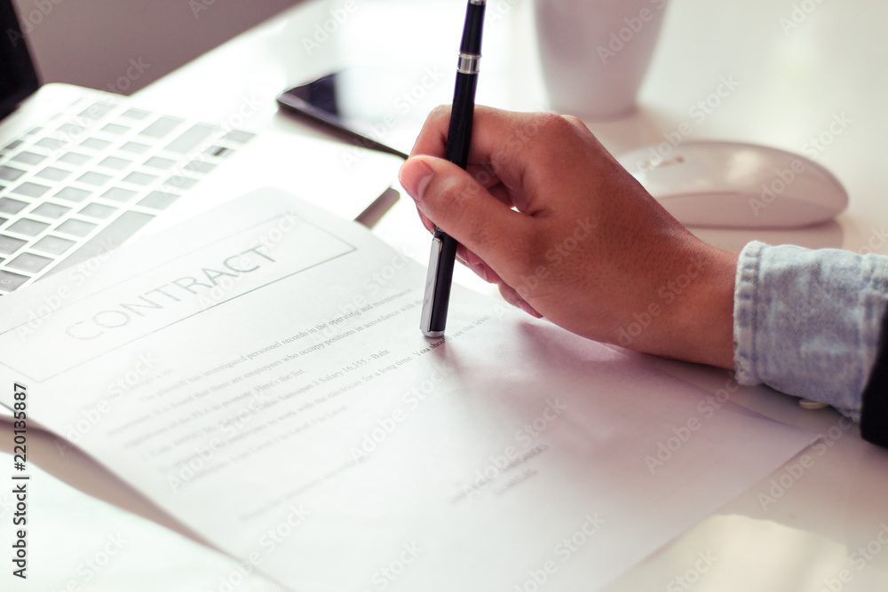 Businessman reading documents in office. Businessman reading documents in office.