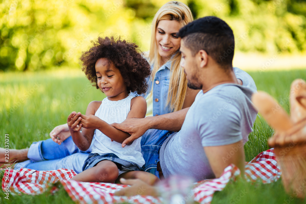 Happy family having fun time on picnic Happy family having fun time on picnic
