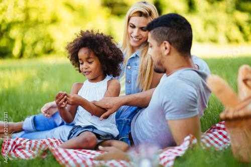 Happy family having fun time on picnic © NDABCREATIVITY