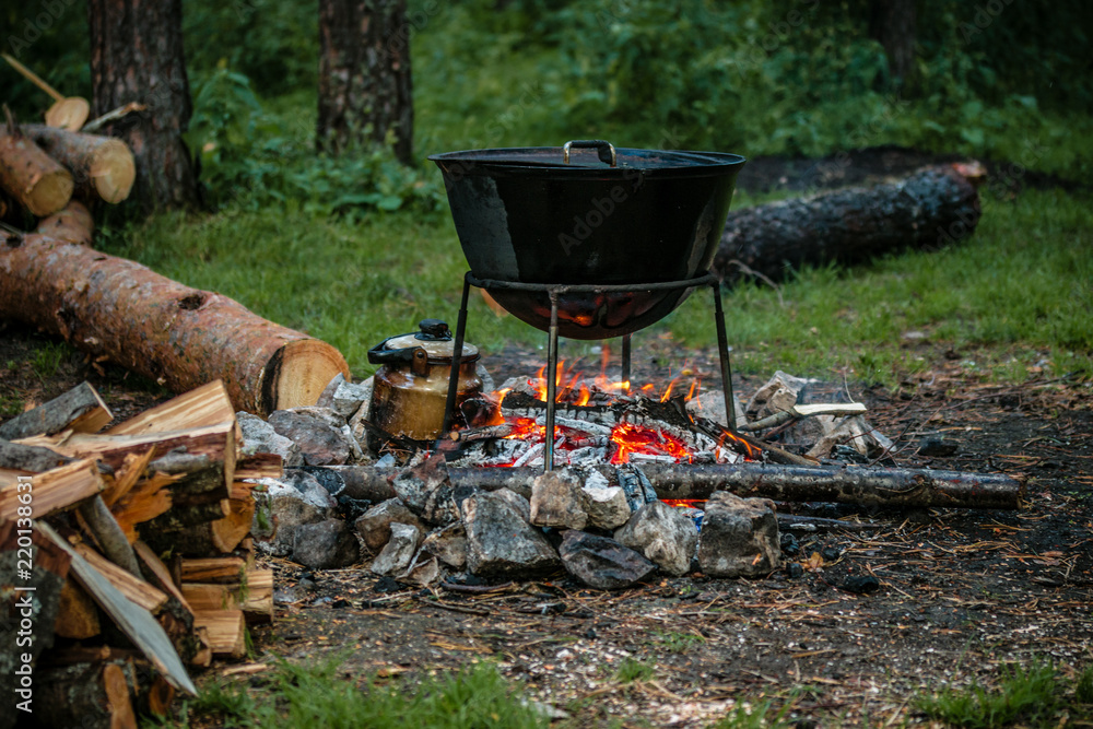 a cauldron for cooking is on the fire a cauldron for cooking is on the fire