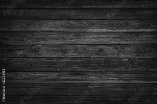 Old, long logs. Black texture of wood.