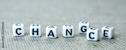 Changing white cubes with word change to chance on grey background photo