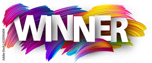 Winner paper poster with colorful brush strokes.