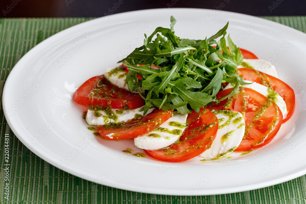 Caprese: light snack including tomatoes, mozzarella, olive oil and basil. Caprese: light snack including tomatoes, mozzarella, olive oil and basil.