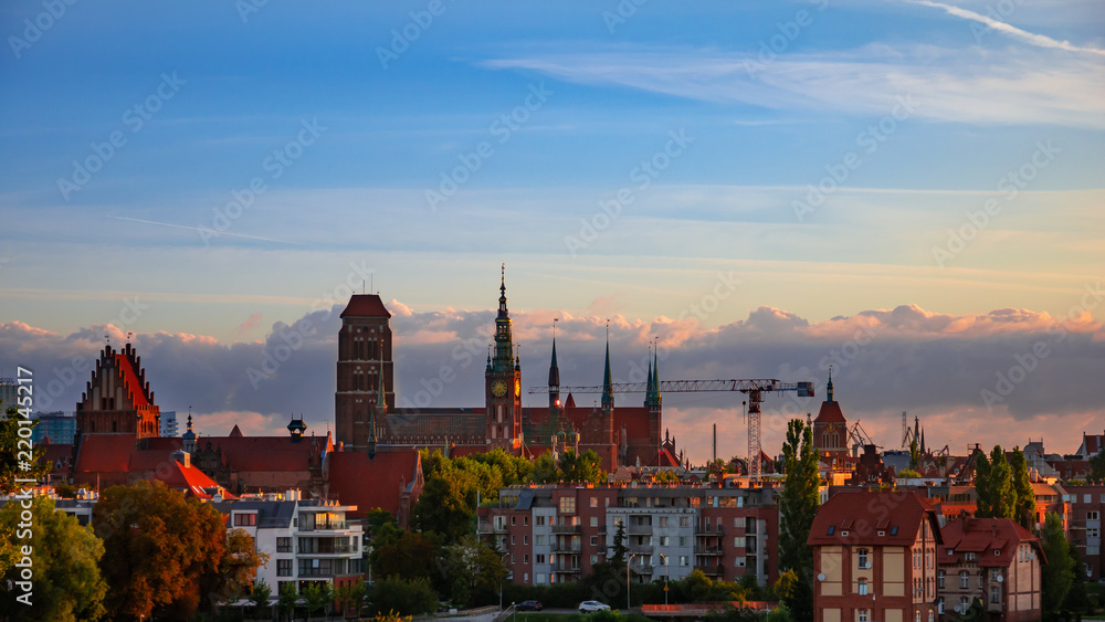 Beautiful and colorful cityscape of Gdansk, St. Mary's Basilica at sunrise.