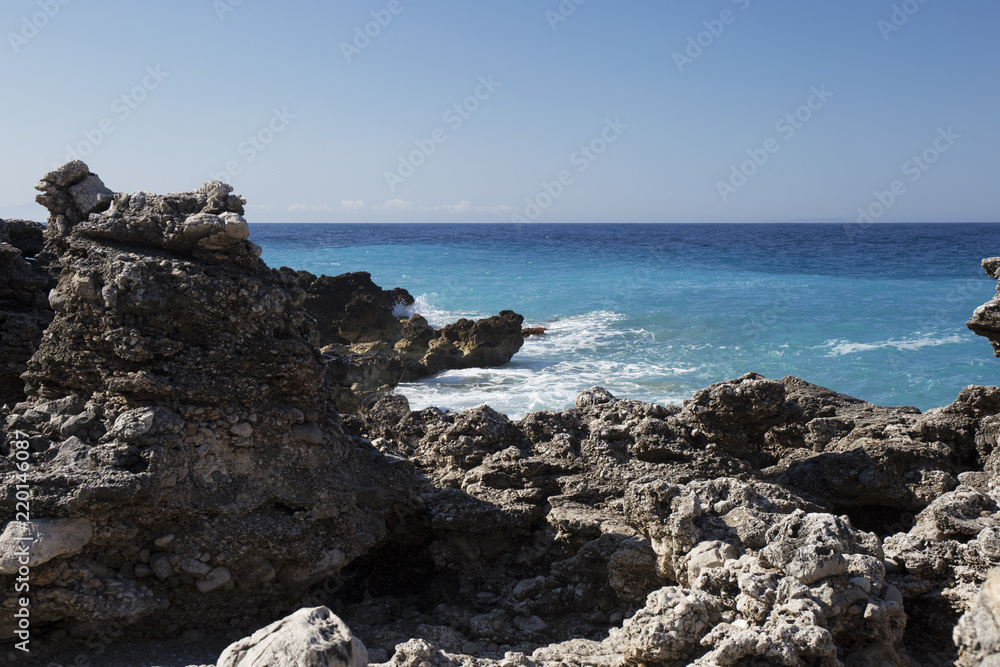 Albanian coast.beautiful view on the rock sea shore,blue sea and wave. Albanian coast.beautiful view on the rock sea shore,blue sea and wave.