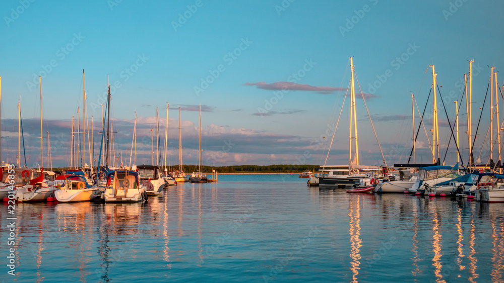 Vistula river with sailboats at marina of National Sailing Centre in the evening at Gorki Zachodnie