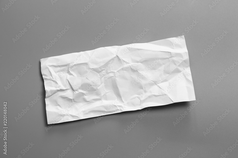 Blank portrait mock-up crumpled paper. brochure magazine isolated on Gray background, changeable background / White paper isolated.