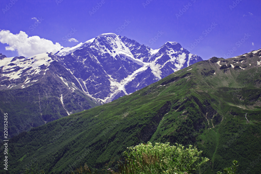 Glacier Seven and pastoral view on mountains in valley near Elbrus
