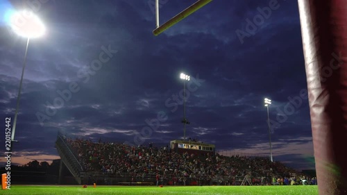 Full high school stadium at dusk dolly
