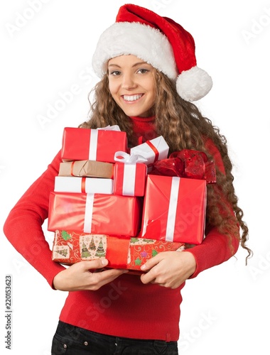 Young Woman In Santa Hat Holding Presents - Isolated
