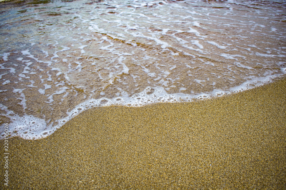 wave surf on the sandy beach