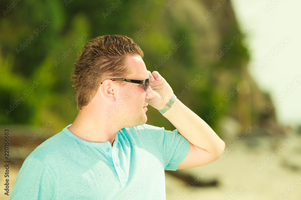 Man spending free time outside, looking at nature Man spending free time outside, looking at nature
