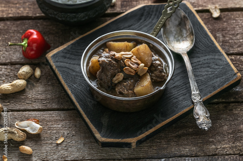 Thai Beef Massaman Curry with Rice, dark background copy space