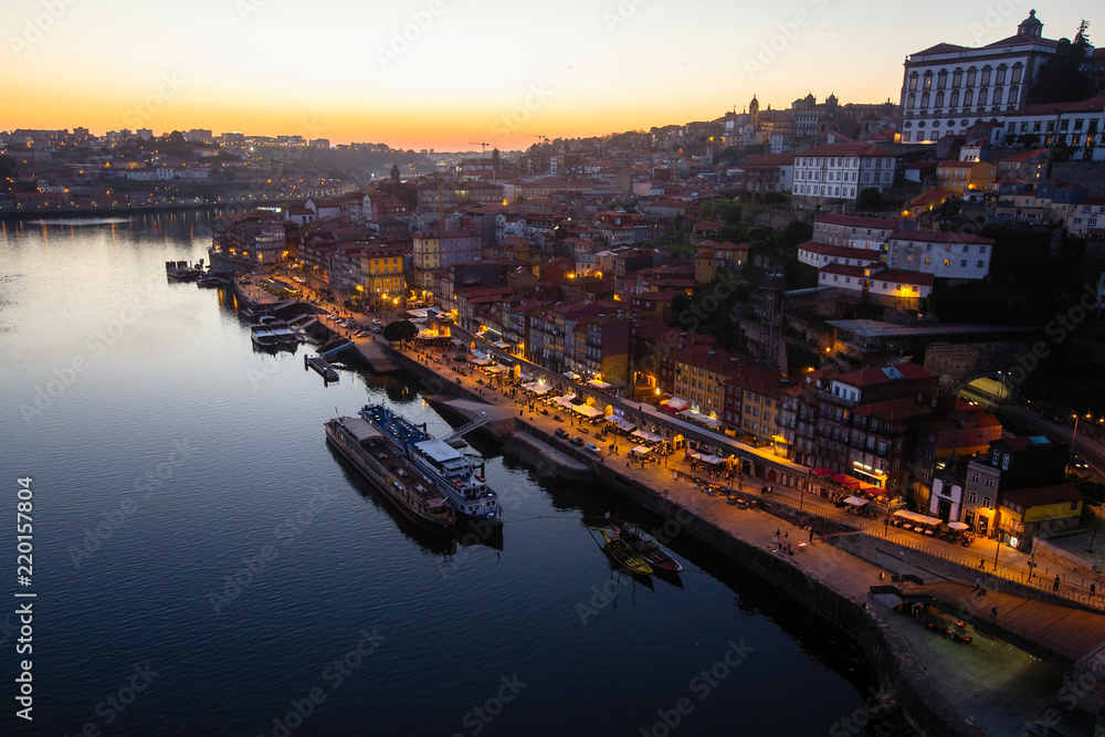 Top view of Douro river and Ribeira at night, Porto, Portugal.