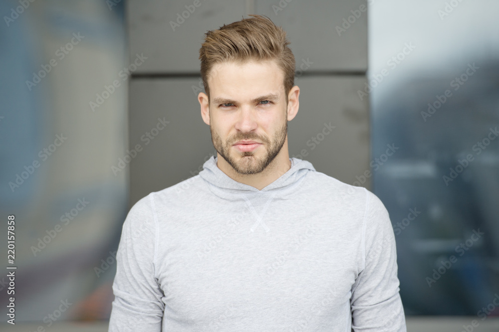 He radiates confidence. Guy bearded attractive care style and appearance. Man with bristle strict face urban background. Man with beard or unshaven guy looks handsome and cool. Confidence concept He radiates confidence. Guy bearded attractive care style and appearance. Man with bristle strict face urban background. Man with beard or unshaven guy looks handsome and cool. Confidence concept