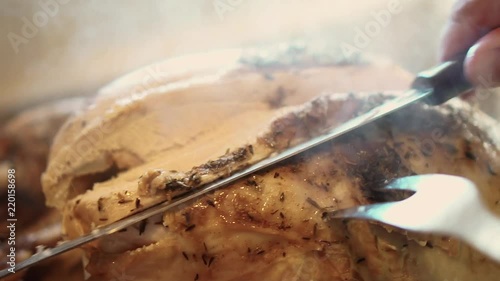 Carving the breast of a turkey close up, in slow motion