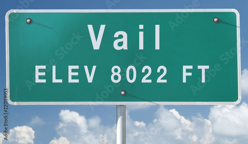 Vail, Colorado Elevation City Limit Sign With Partly Cloudy Sky Background