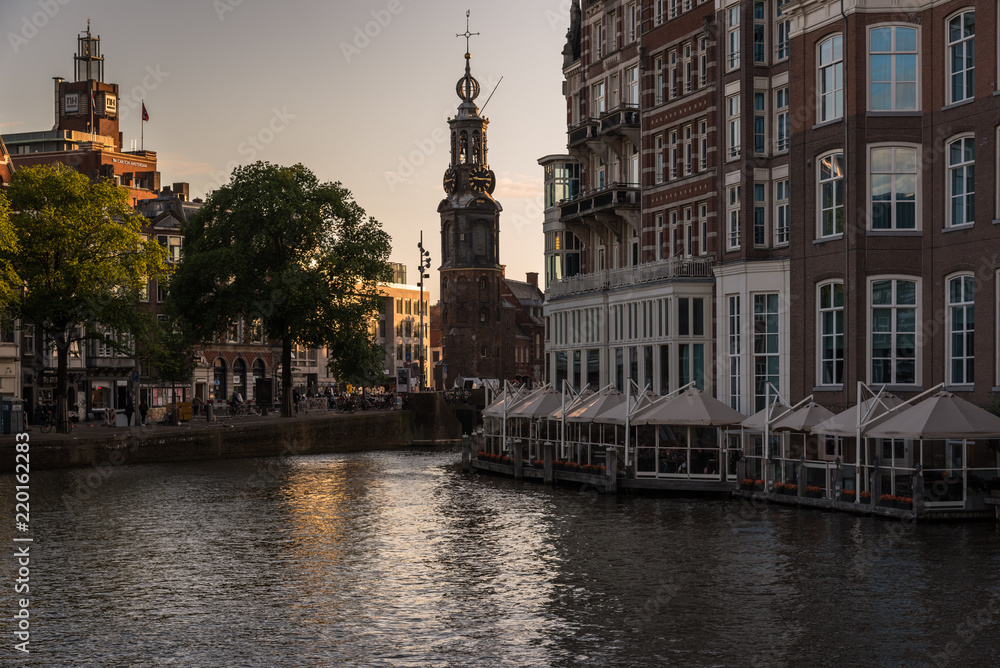 The Munttoren tower reflected in the canal, Amsterdam, the Netherlands