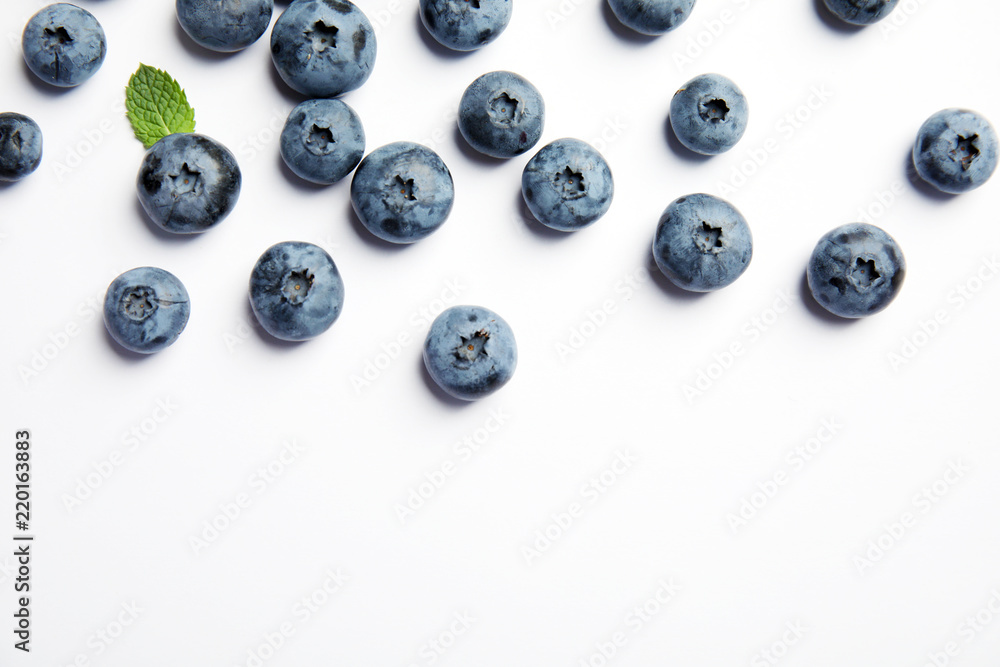 Flat lay composition with tasty blueberry and space for text on white background Flat lay composition with tasty blueberry and space for text on white background