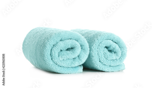 Rolled clean soft towels on white background