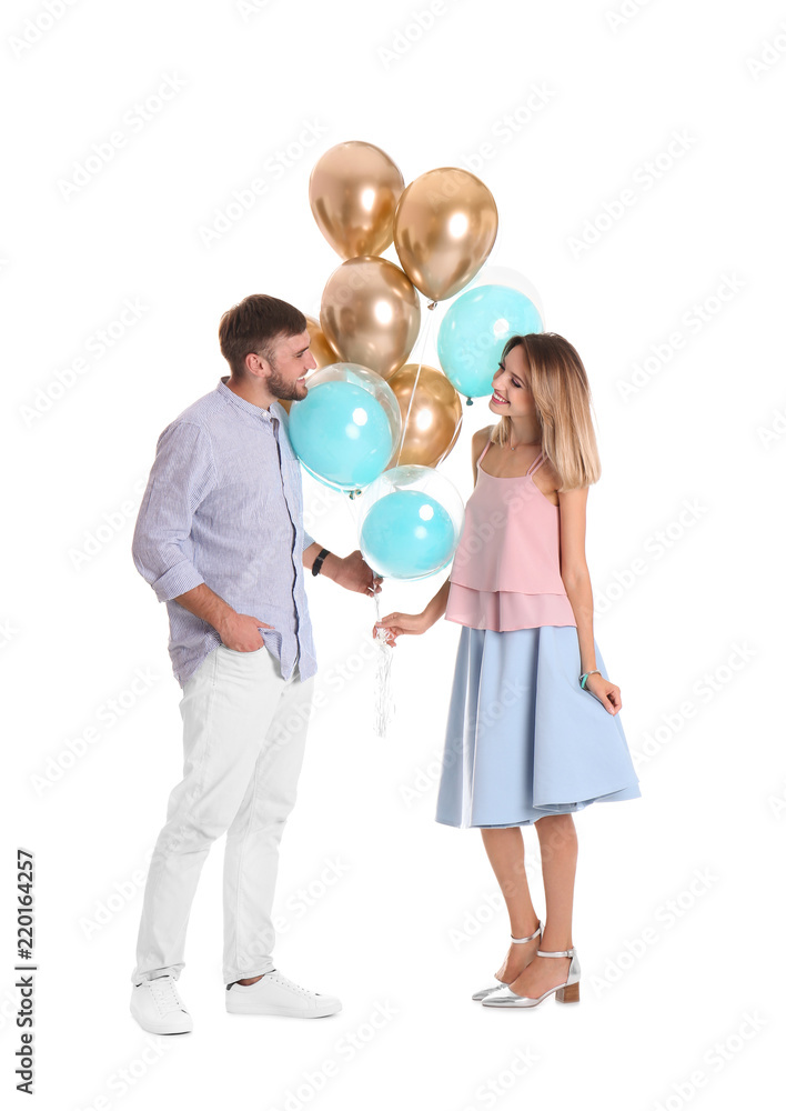 Young couple with air balloons on white background Young couple with air balloons on white background