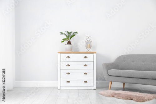 Fototapeta Naklejka Na Ścianę i Meble -  Chest of drawers in stylish living room interior