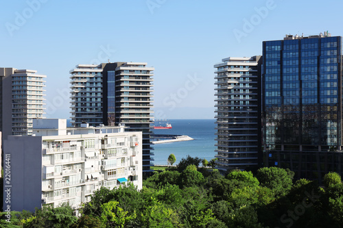 Picturesque view of city with beautiful buildings near sea